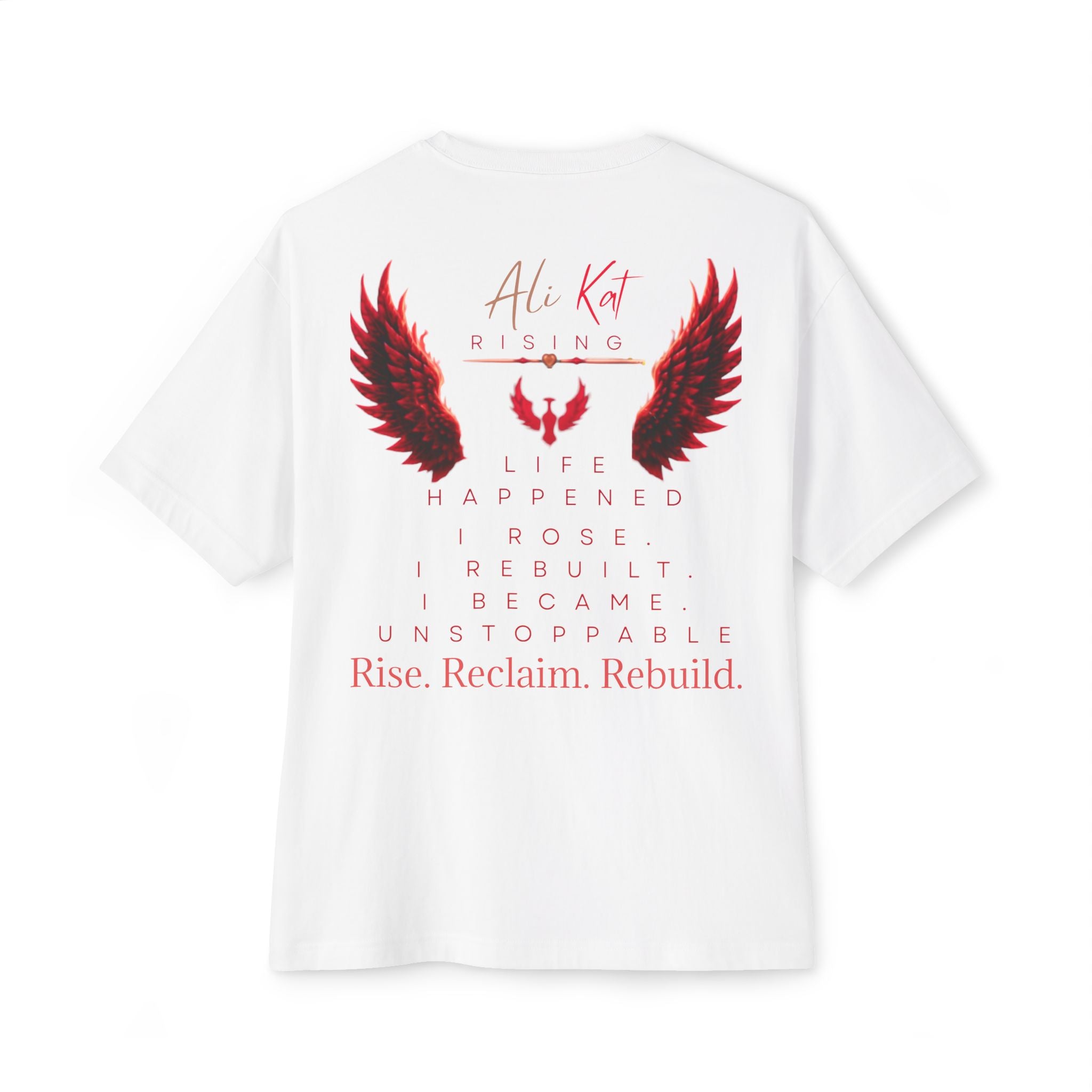 Introducing the Phoenix Season: Vol. 1 Signature Oversized Tee by AliKat Rising—an oversized unisex t-shirt crafted from premium heavyweight white cotton. This standout tee features bold red and black wings artwork and inspiring text: “Life happened. I rose. I rebuilt. I became. Unstoppable. Rise. Reclaim. Rebuild.” The back displays “AliKat Rising,” making this the ultimate symbol of rising above challenges and a must-have from the Phoenix Season collection.