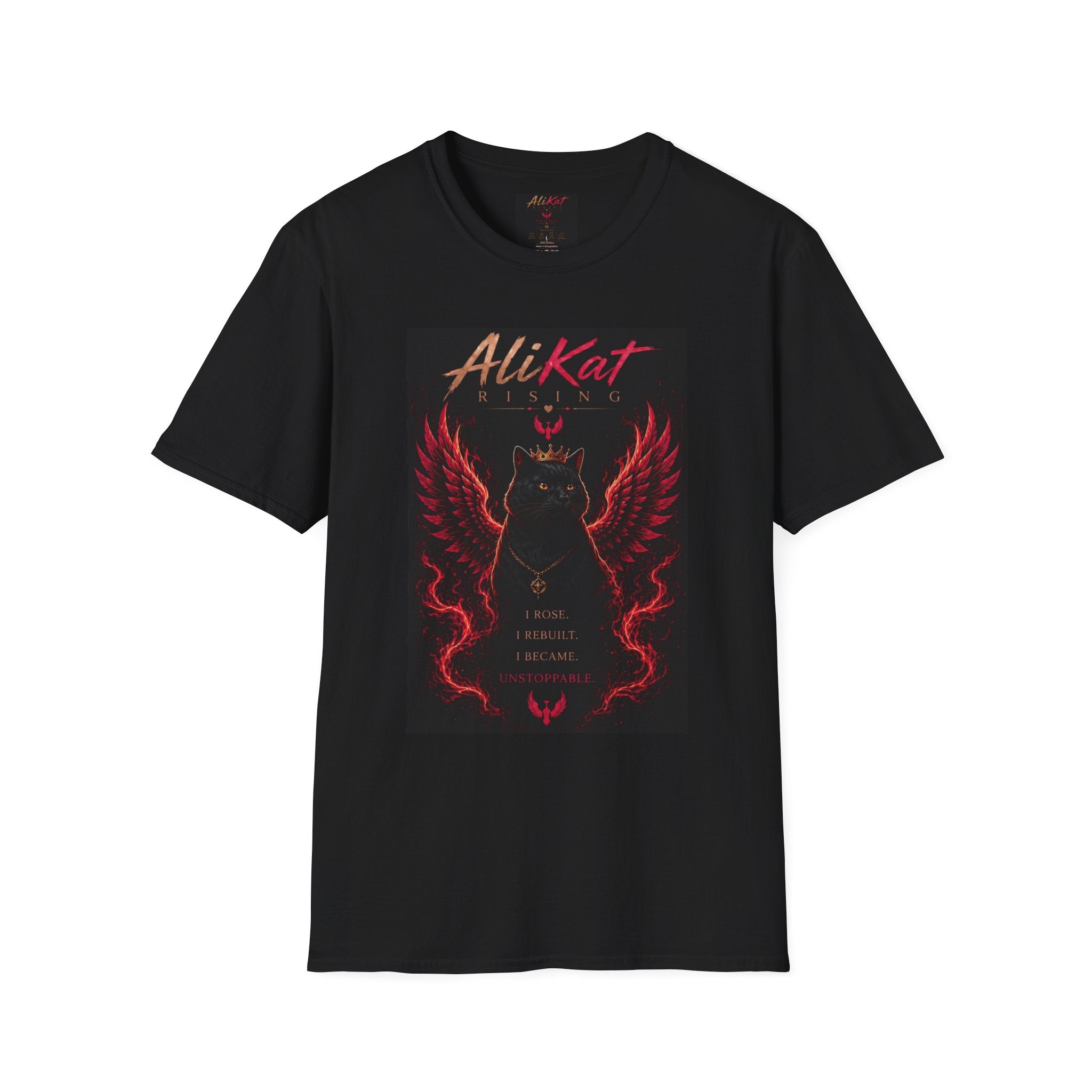 Introducing the Phoenix Vol. 1 Graphic Tee from AliKat Rising — a bold black t-shirt showcasing a striking graphic of a black cat with fiery red wings alongside the text: "AliKat RISING. I rose. I rebuilt. I became unstoppable." This dramatic, mystical design is available in sizes S, M, L, XL, and 2XL for the perfect fit.