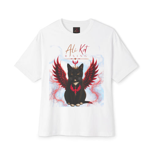 Introducing the Phoenix Season: Vol. 1 Signature Oversized Tee by AliKat Rising—a white t-shirt made from premium heavyweight cotton. It showcases a striking black cat with red, fiery wings and a heart-shaped flame on its chest, along with the text "Ali Kat RISING" above in bold red and gold stylized lettering. Designed for an oversized, unisex fit to deliver standout comfort and style.