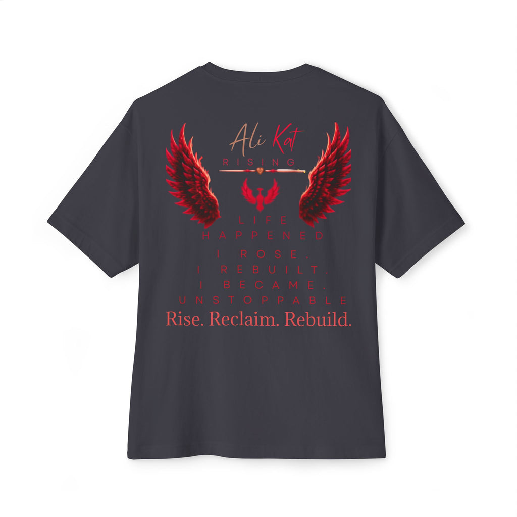 Introducing the Phoenix Season: Vol. 1 Signature Oversized Tee by AliKat Rising—a black unisex t-shirt crafted from premium heavyweight cotton. This bold statement piece features vibrant red angel wings and the empowering message: Ali Kat Rising. Life happened. I rose. I rebuilt. I became unstoppable. Rise. Reclaim. Rebuild, all centered on the back for maximum impact on your journey of transformation.