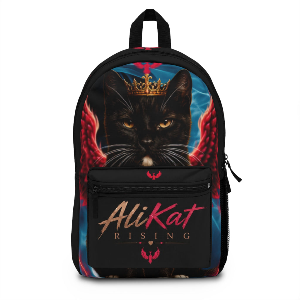 Discover the Phoenix Vol. 1 Backpack | AliKat Rising by AliKat Rising, an art-inspired backpack featuring a crowned black cat with striking red wings and bold "AliKat Rising" text on the front pocket, set against a vibrant blue and black backdrop.