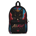 Discover the Phoenix Vol. 1 Backpack | AliKat Rising by AliKat Rising, an art-inspired backpack featuring a crowned black cat with striking red wings and bold "AliKat Rising" text on the front pocket, set against a vibrant blue and black backdrop.