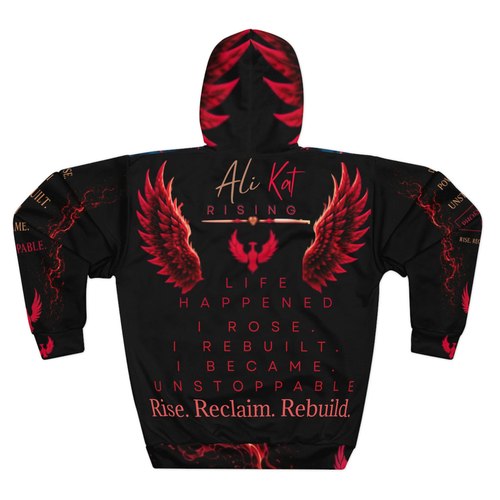 The Phoenix Vol. 1 Premium Motivational Hoodie from AliKat Rising features bold red wing graphics and the empowering text: “Life happened. I rose. I rebuilt. I became unstoppable. Rise. Reclaim. Rebuild.” The design includes “Ali Kat” at the top with “Rising” right below it. Available in sizes XS to 2XL—please consult the size chart for ideal fit and clothing length.