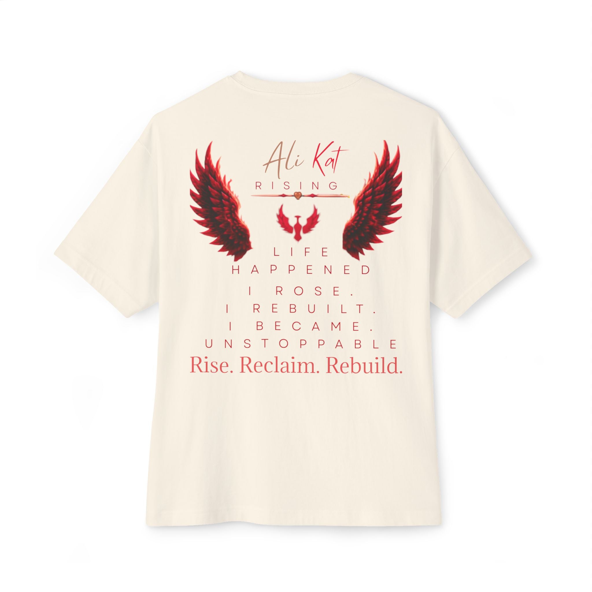 Introducing the Phoenix Season: Vol. 1 Signature Oversized Tee from AliKat Rising—a premium off-white unisex t-shirt crafted from heavyweight cotton and featuring bold red and black wings graphic. The oversized design displays the empowering text: AliKat Rising. Life happened. I rose. I rebuilt. I became unstoppable. Rise. Reclaim. Rebuild.