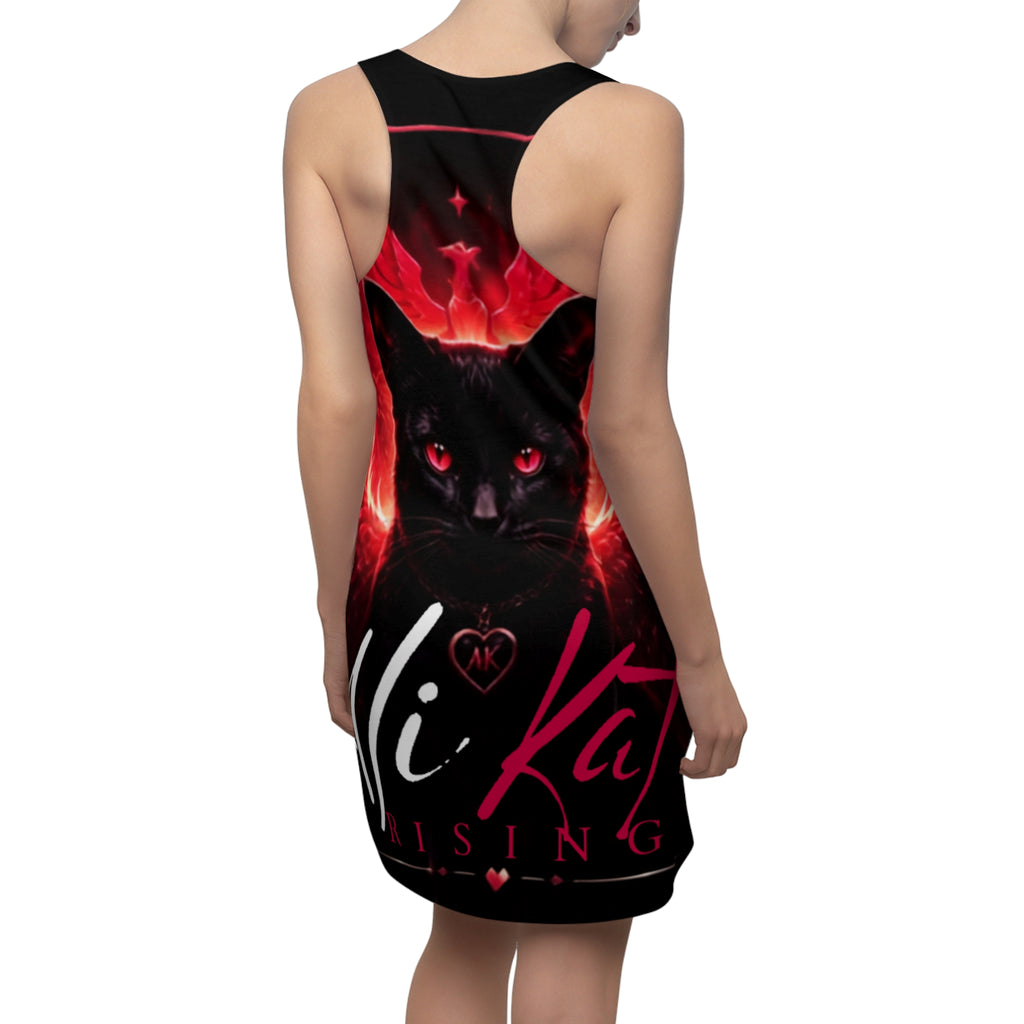 A woman wearing the Phoenix Vol. 1 Racerback Dress by AliKat Rising, a sleeveless all-over print dress featuring a black cat with glowing red eyes, a heart locket, and the "Hi Kat Rising" text in pink and white on a striking fiery red-black background.